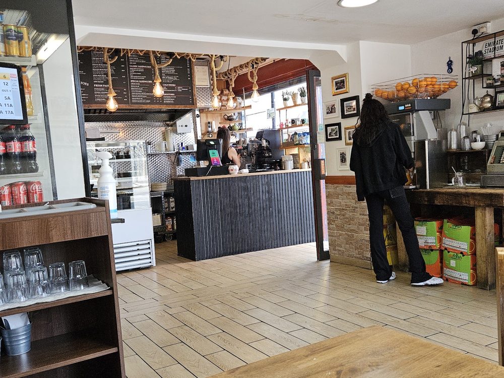 Inside Little Wonder Cafe, looking towards the service counter and coffee machine